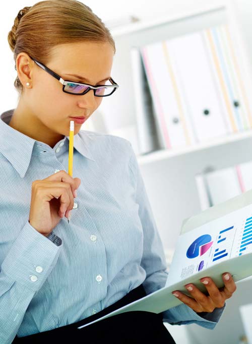 Female Accountant looking over data and statistics